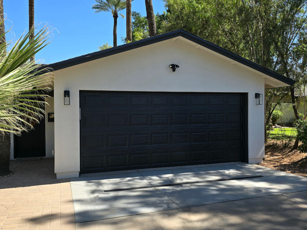 2 Car Garage with white stucco and black door- Garage Builder Phoenix AZ